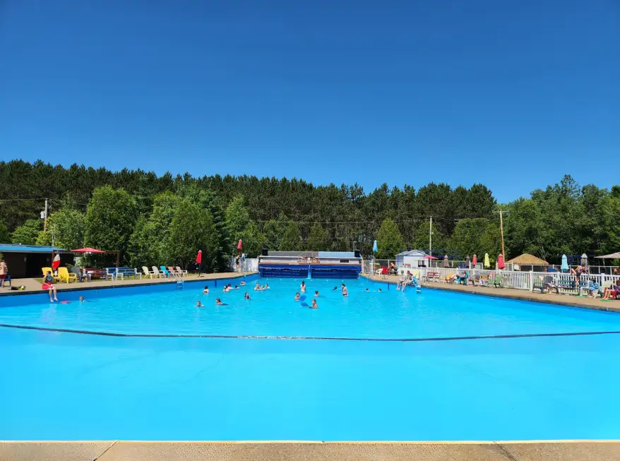 a large pool with people swimming in it