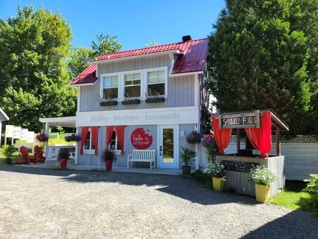 a building with red curtains and a bench